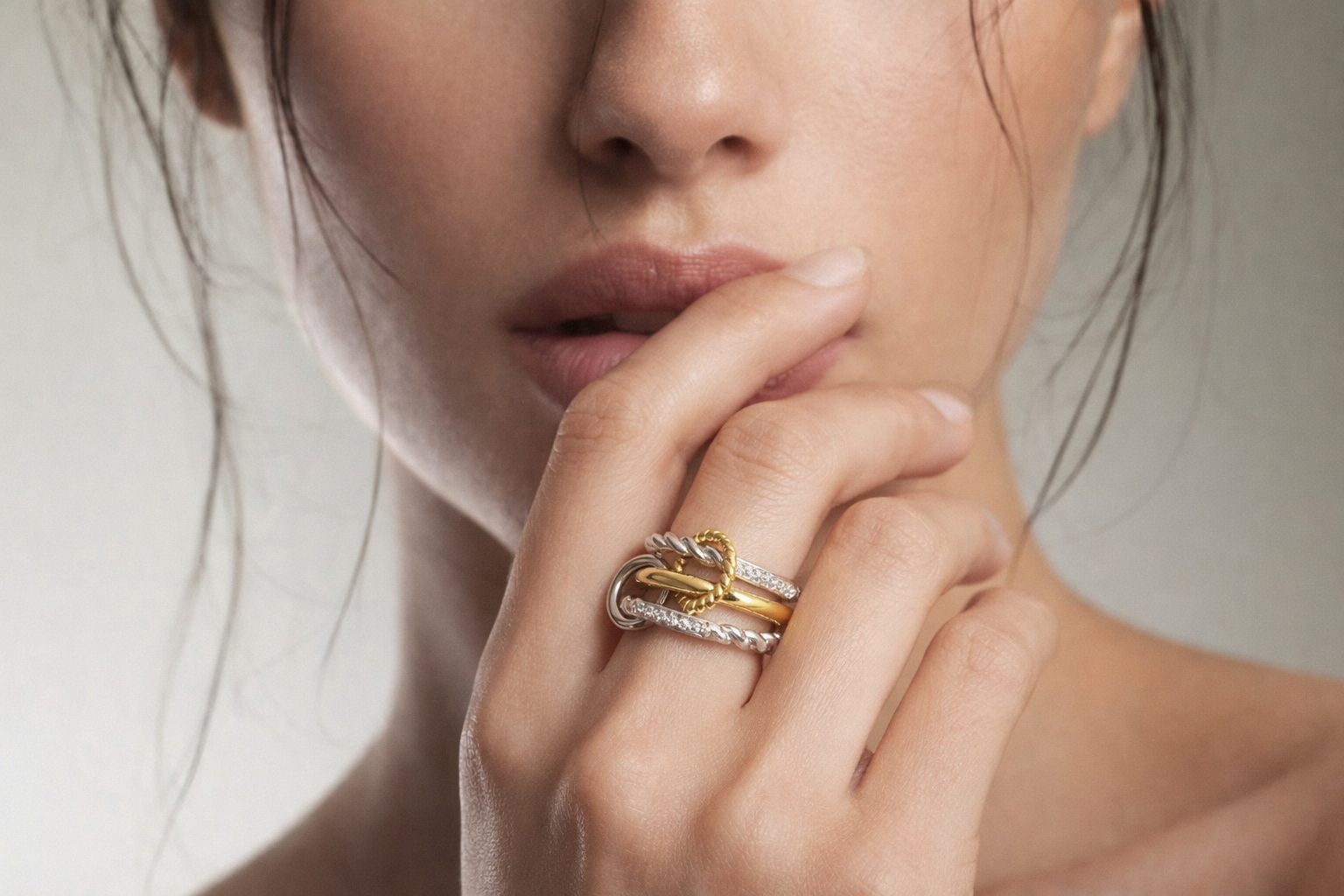 Linked rings and connected band rings styled in a mixed-metal ring stack