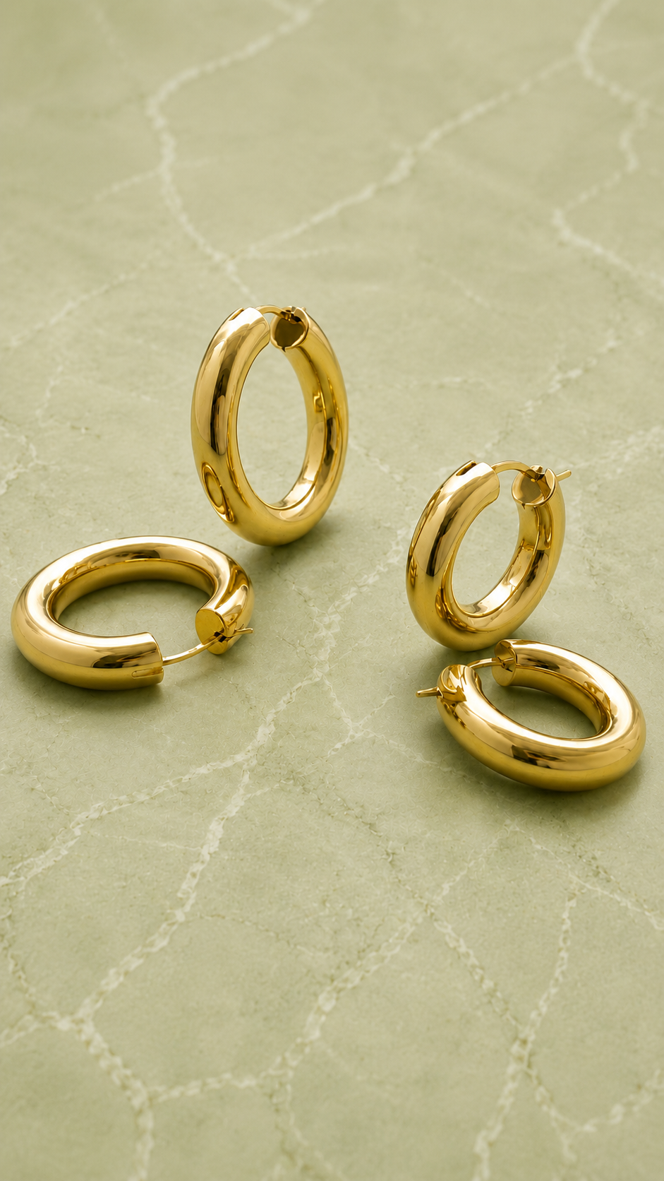 types of hoop earrings, huggie earrings, gold huggie earrings, chunky gold hoops, small gold hoop earrings, twisted gold hoops, two-tone hoop earrings, hoop earring size guide, hypoallergenic hoop earrings