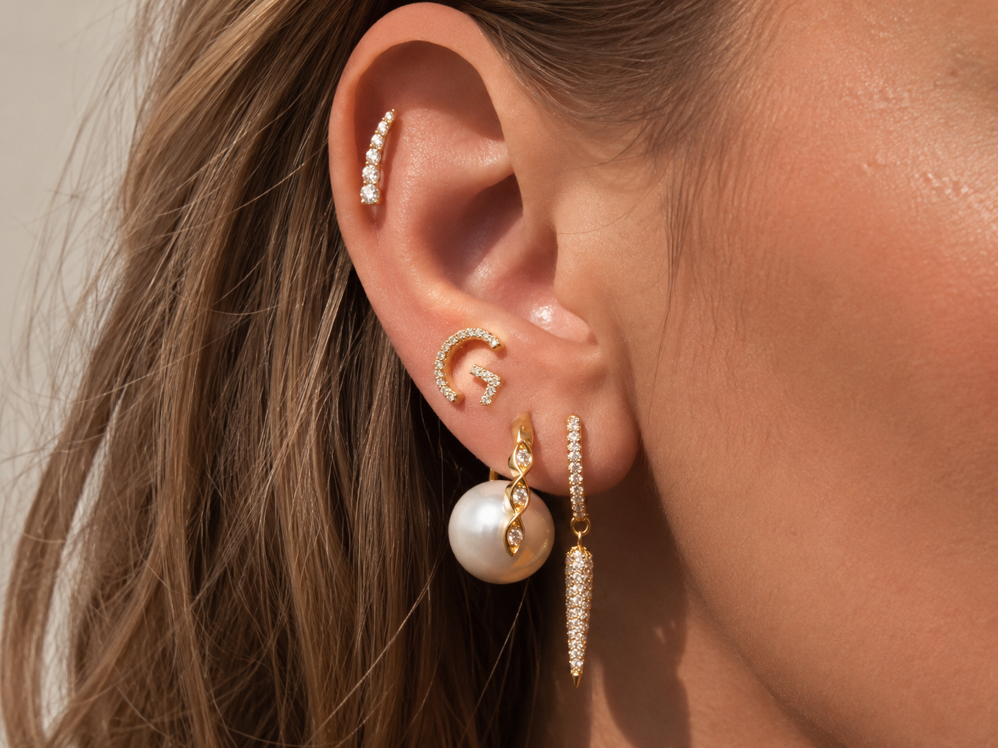 Curated ear piercings with hypoallergenic studs for the new piercing aftercare guide