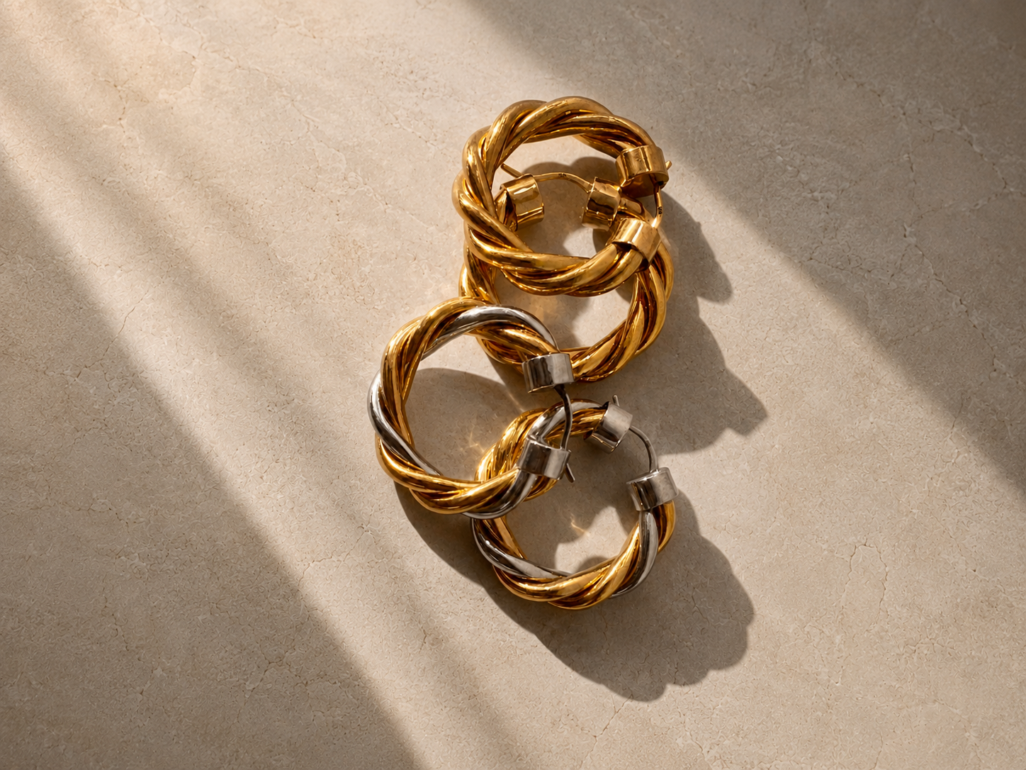 Tina twisted mixed metal hoop earrings in gold and silver