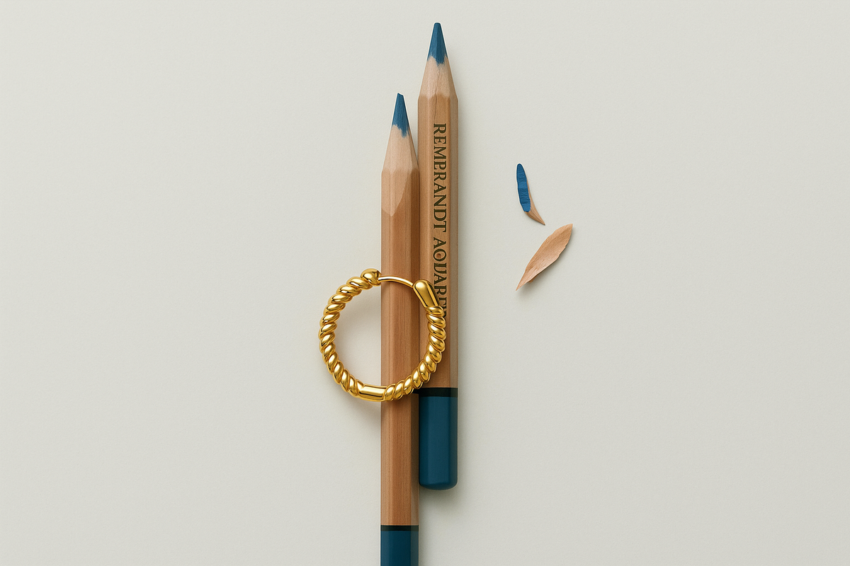 Flat lay of chic back-to-school earrings including silver studs, gold huggies, and delicate ear climbers styled with soft stationery tones — the perfect everyday jewelry for school or work.