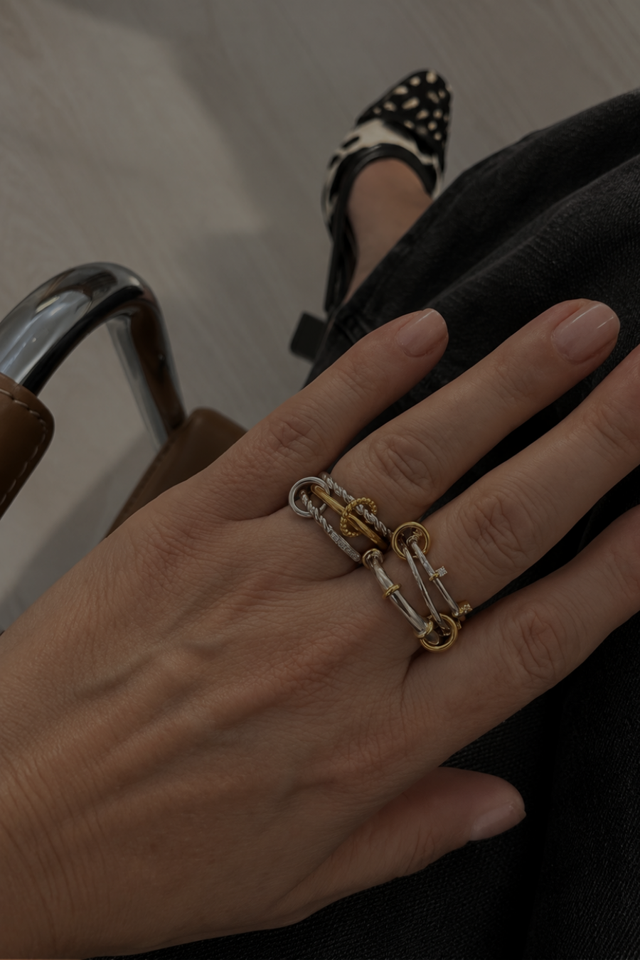 Dimitra’s mixed-metal ring stack by Galleria Armadoro featuring the Clara Two-Tone Multi-Band Ring and Carmella Speira Triple Band Pavé Ring worn back-to-back.