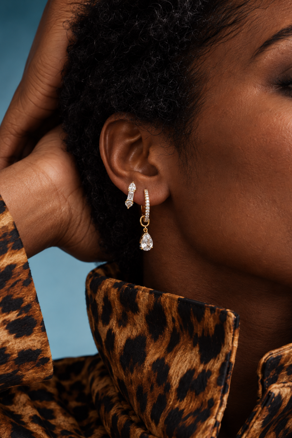 Gold ear stack by Galleria Armadoro featuring a Vittoria teardrop charm on a pavé huggie with a coordinating crystal stud.