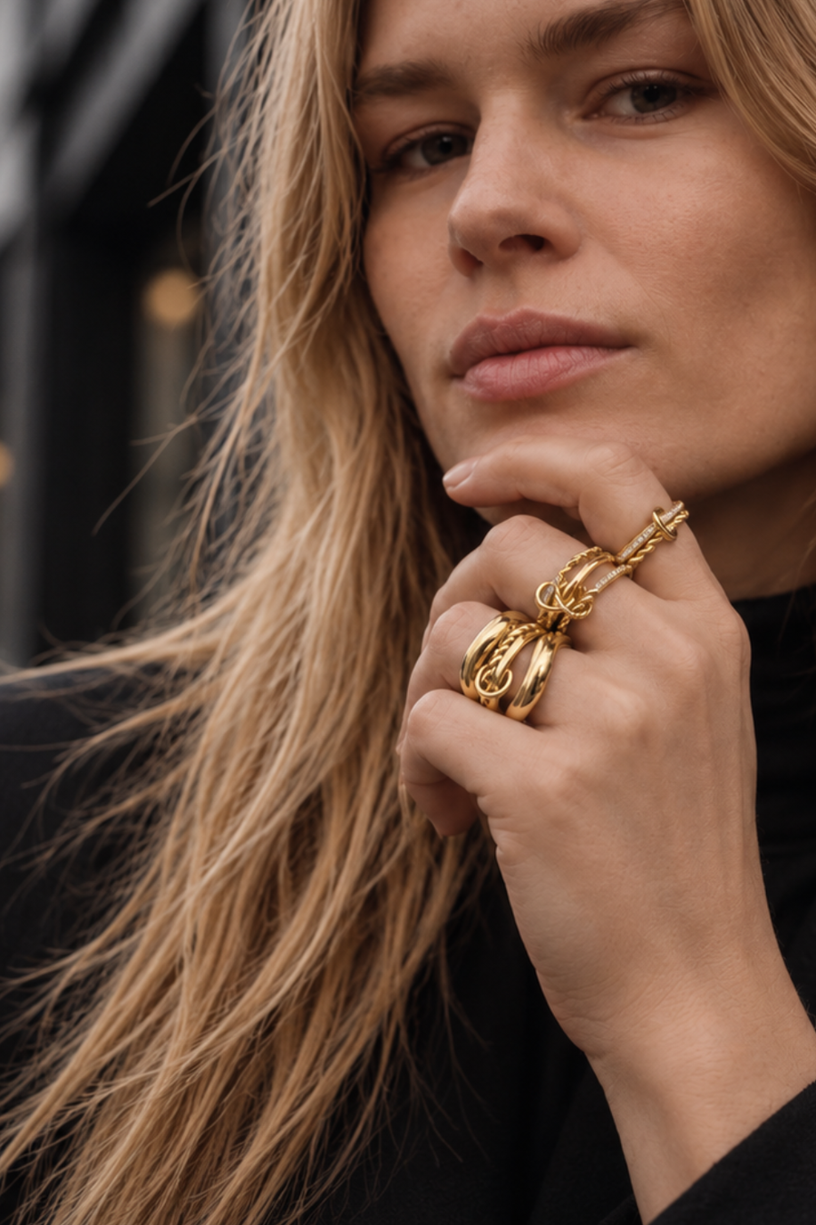 All-gold ring stack by Galleria Armadoro styled with a total-black outfit for a polished sculptural jewellery look.