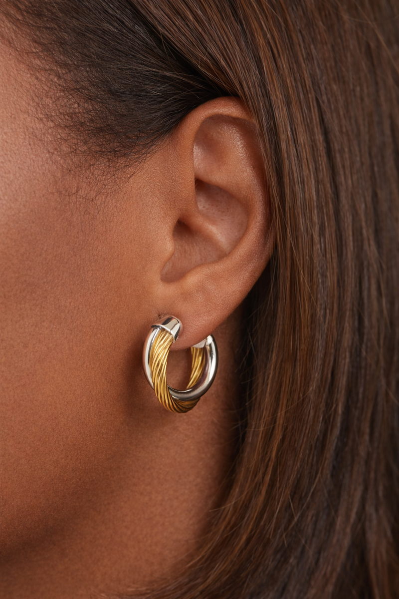 small two-tone hoop earrings worn on ear everyday styling