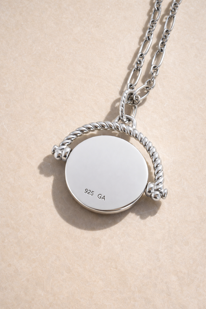 Back of Konstantinato silver coin charm showing engravable surface for a personalised message