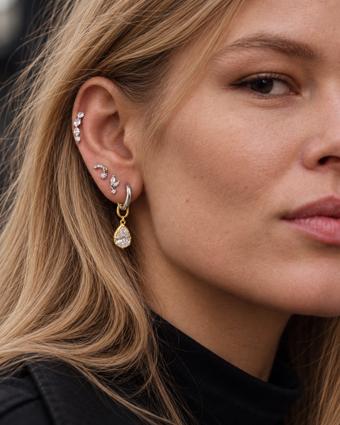 Balanced ear stack by Galleria Armadoro featuring the Riviera Pin on the helix and the Vittoria modular teardrop charm at the lobe.