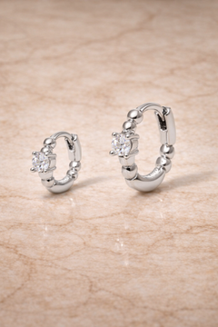 Double ear piercing earrings set with 6.5mm and 8.5mm sterling silver huggies with white CZ for second ear piercings