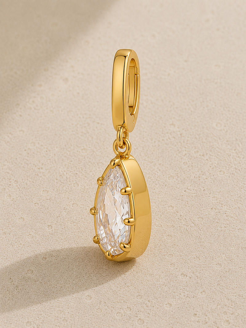 Vittoria gold crystal hook charm hanging from signature clasp