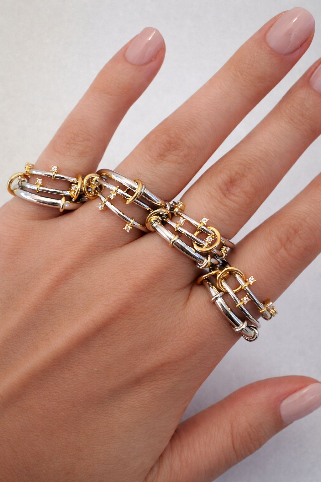 Clara two-tone multi-band ring with polished silver-tone bands and gold accents