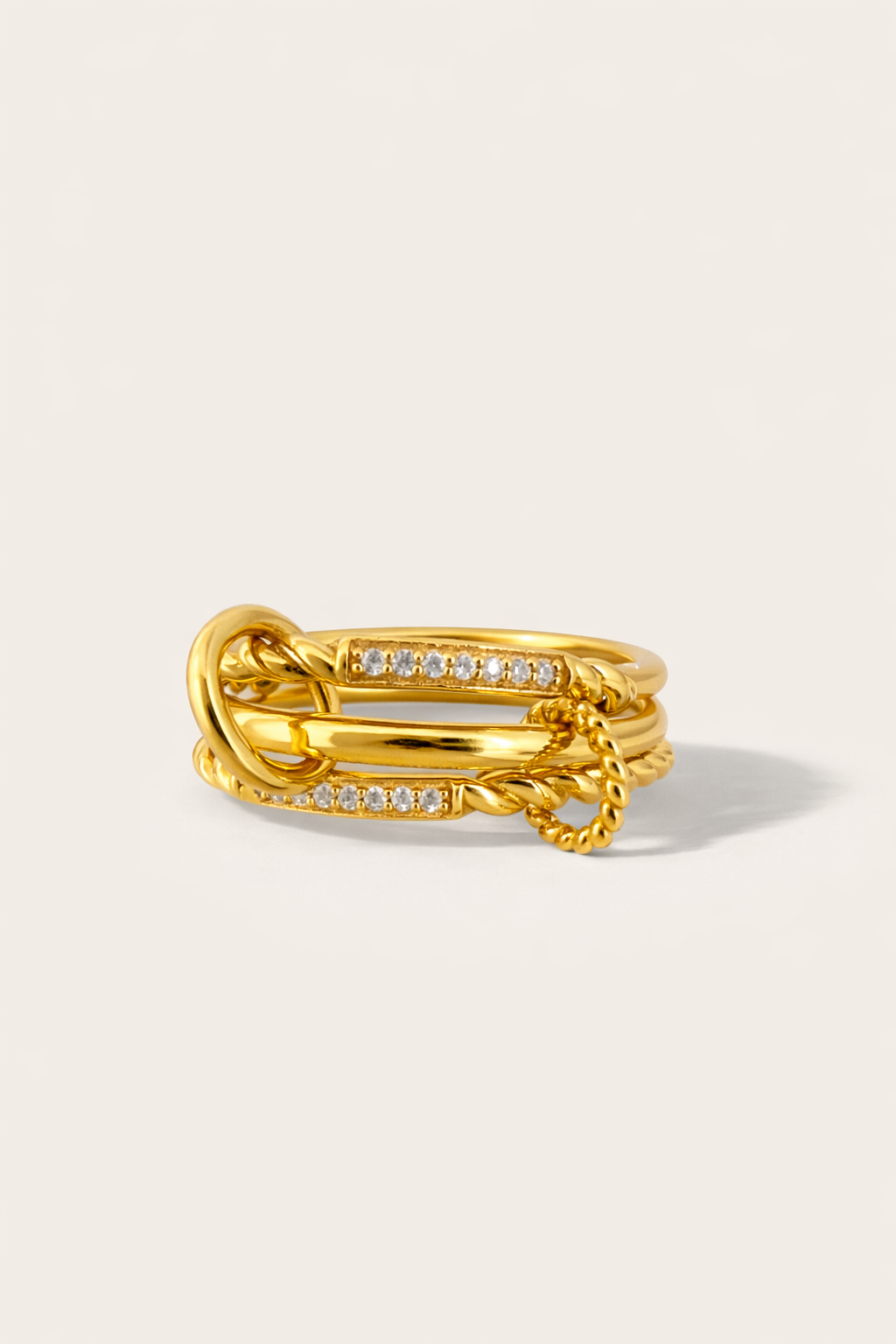 Carmella Speira gold triple-band pavé ring with twisted and polished band details
