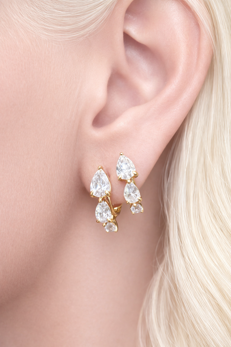 Two earrings in one ear styling with cascade gold huggies for second ear piercings and modern ear stacks