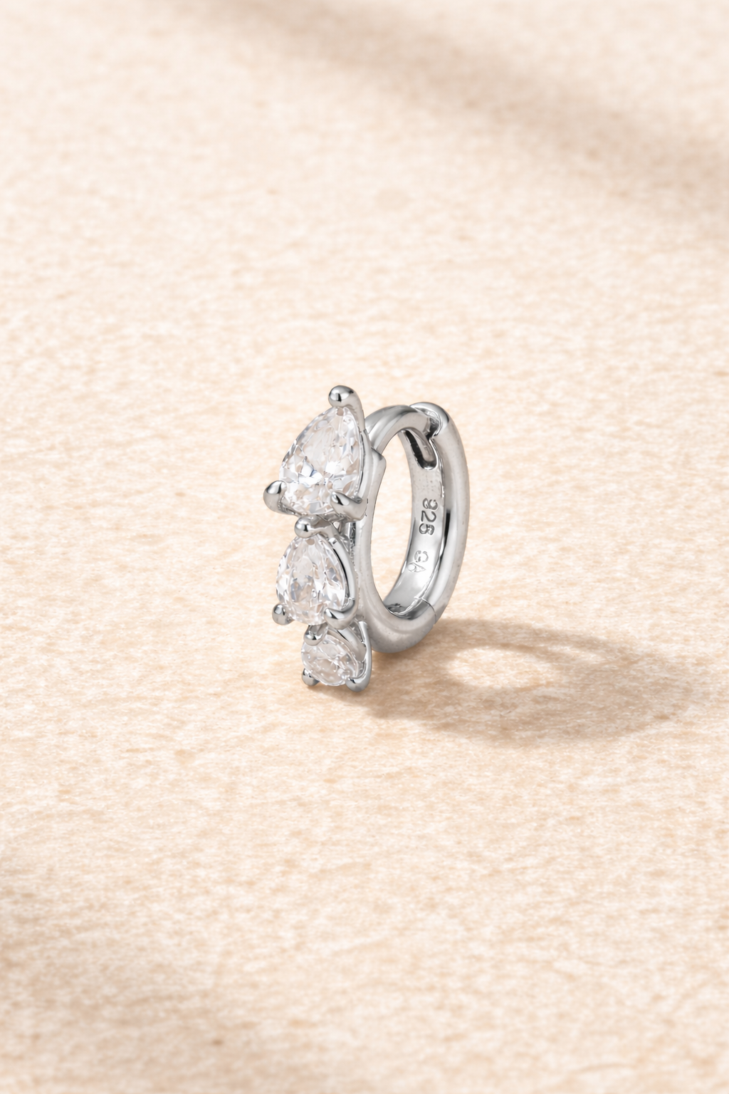 “Cascade Huggie silver 6.5 mm with graduated pear-cut white cubic zirconia”