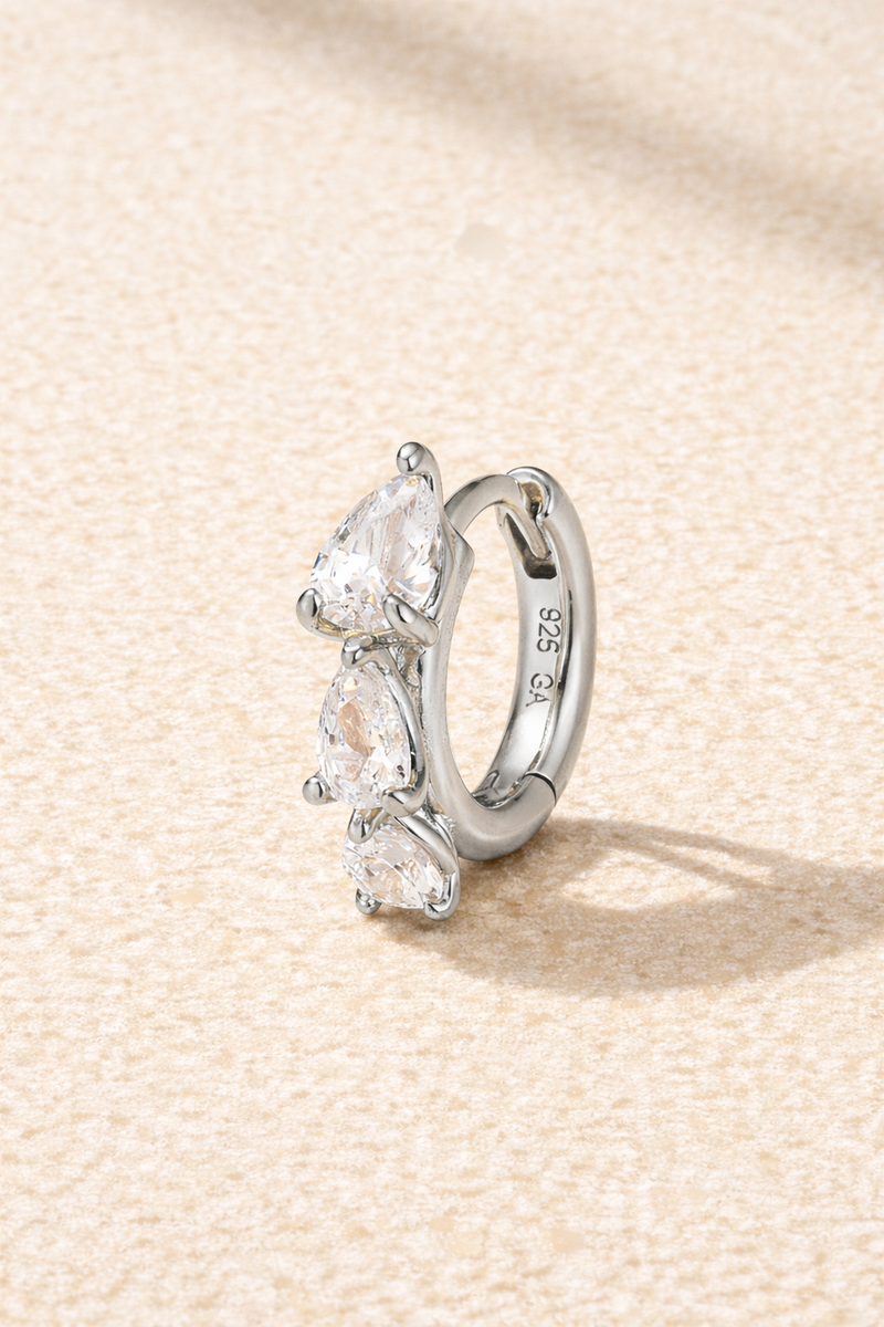 “Cascade Huggie silver with graduated pear-cut white cubic zirconia”