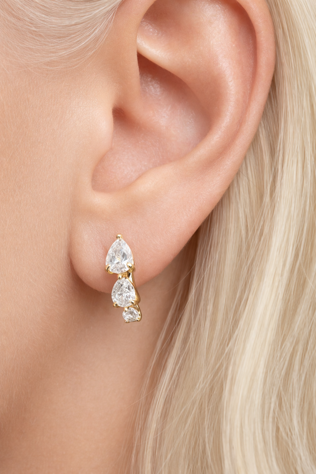 “Cascade gold huggie 6.5 mm worn on second ear piercing”