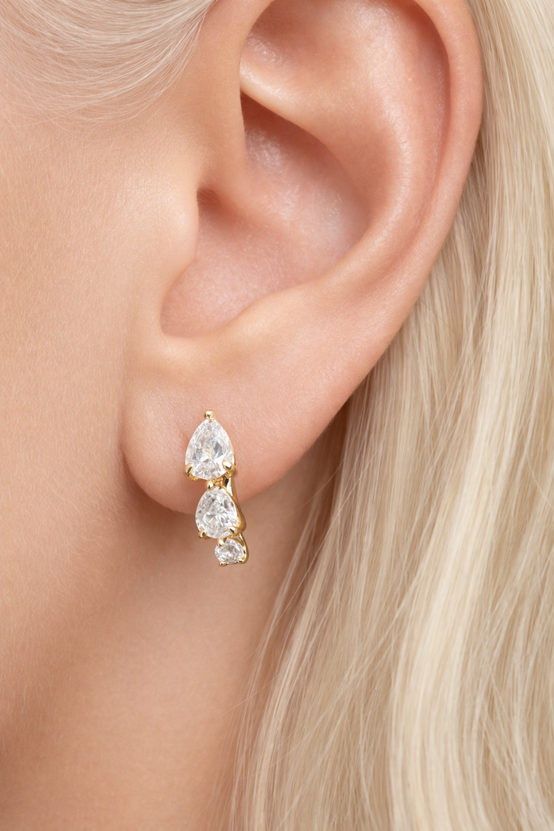 “Cascade gold huggie 6.5 mm worn on second ear piercing”