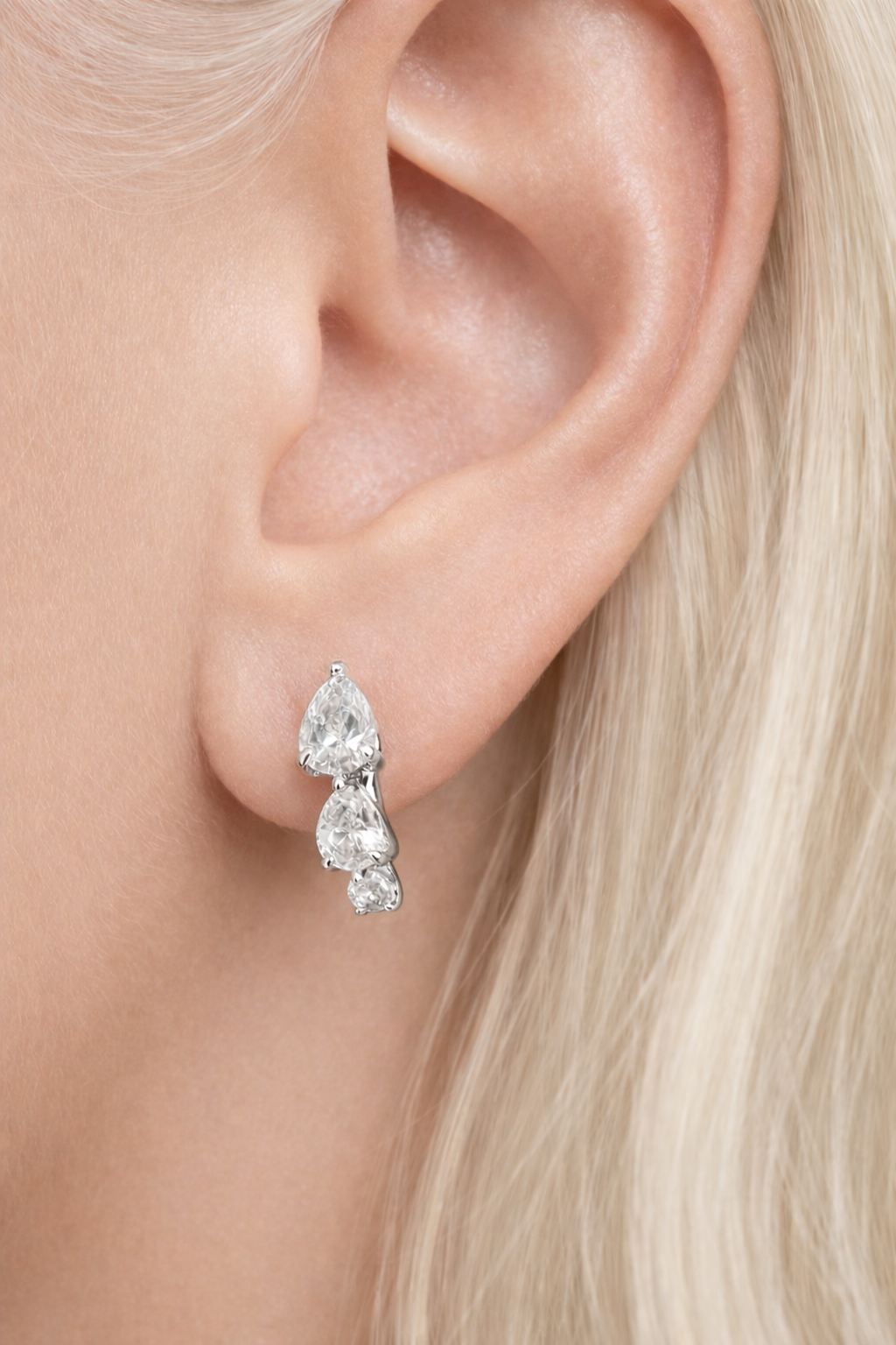 “Cascade silver huggie 6.5 mm worn on second ear piercing”