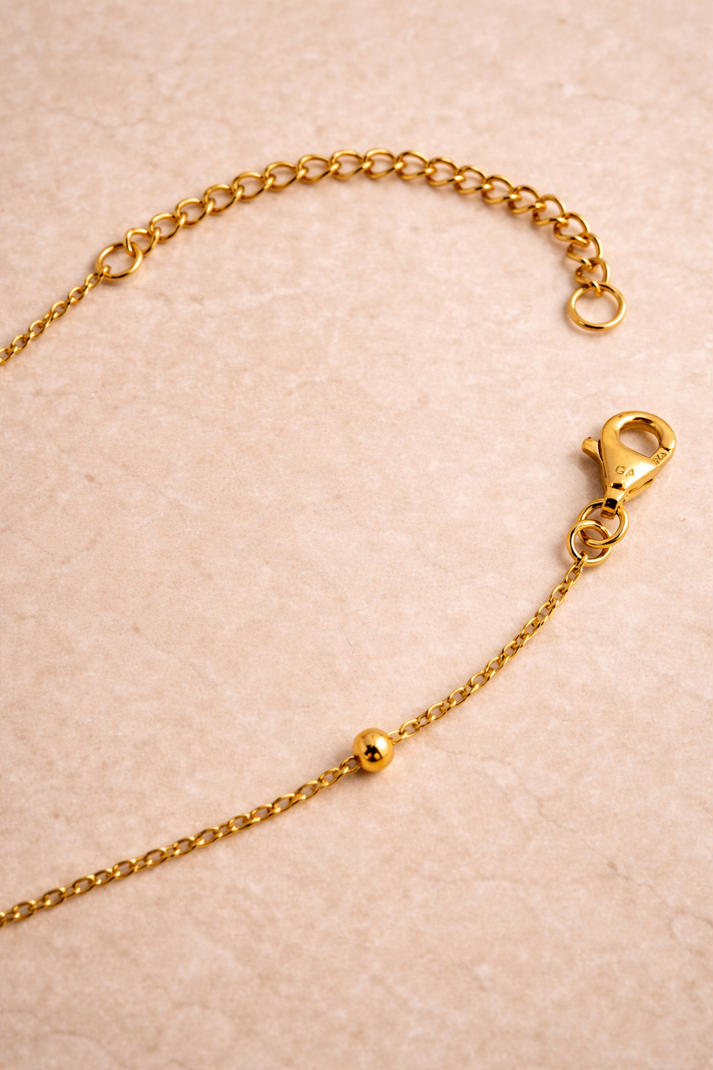 Charlotte gold vermeil chain with eleven bead stations, styled with Speira red coral charm, adjustable necklace length 40+5 cm