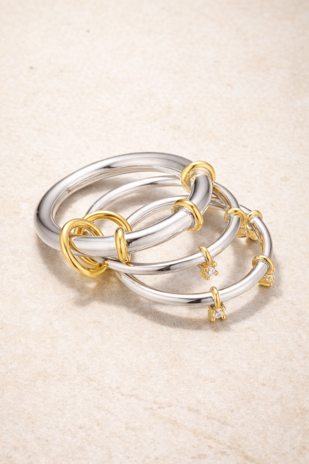 Clara two-tone multi-band ring in silver and gold with sculptural loop details