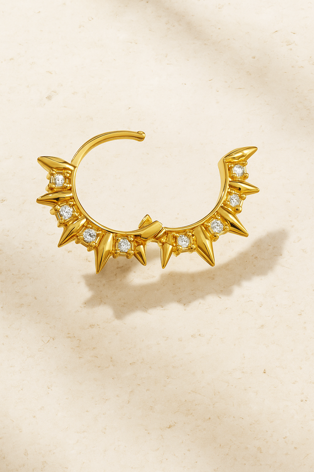 Close-up of Spinetta Gold Huggie Earring showing pointed thorn silhouette and brilliant pavé CZ sparkle.
