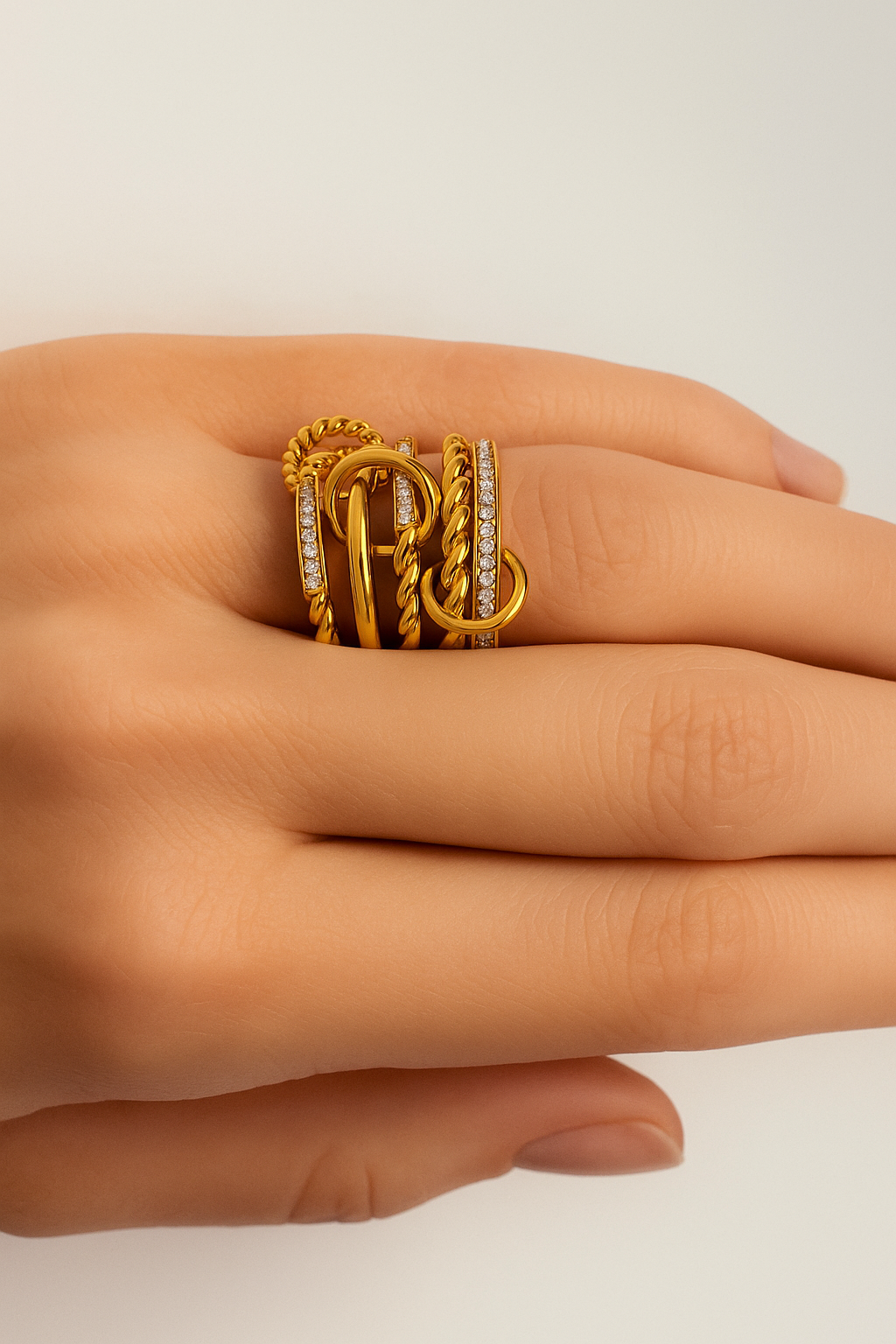 Livia double band pavé gold ring seen from above on closed hand, everyday stacking ring styling.