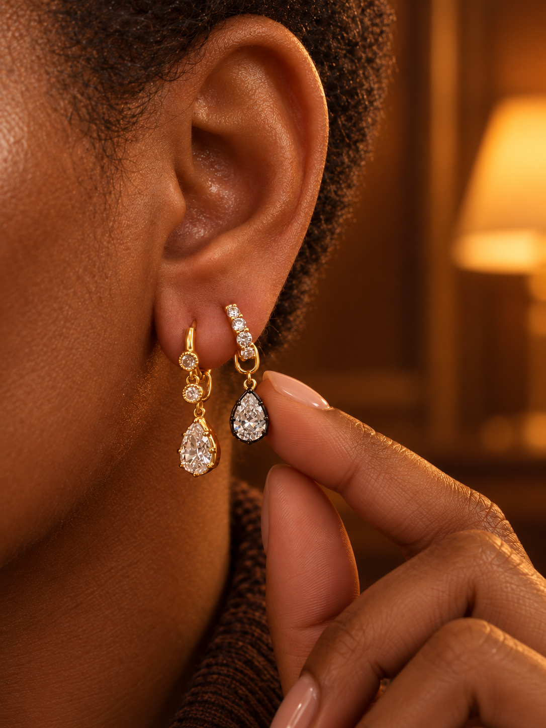 Second ear piercing idea by Galleria Armadoro featuring two detachable Vittoria teardrop earrings in gold and black rhodium mixed-metal finishes.