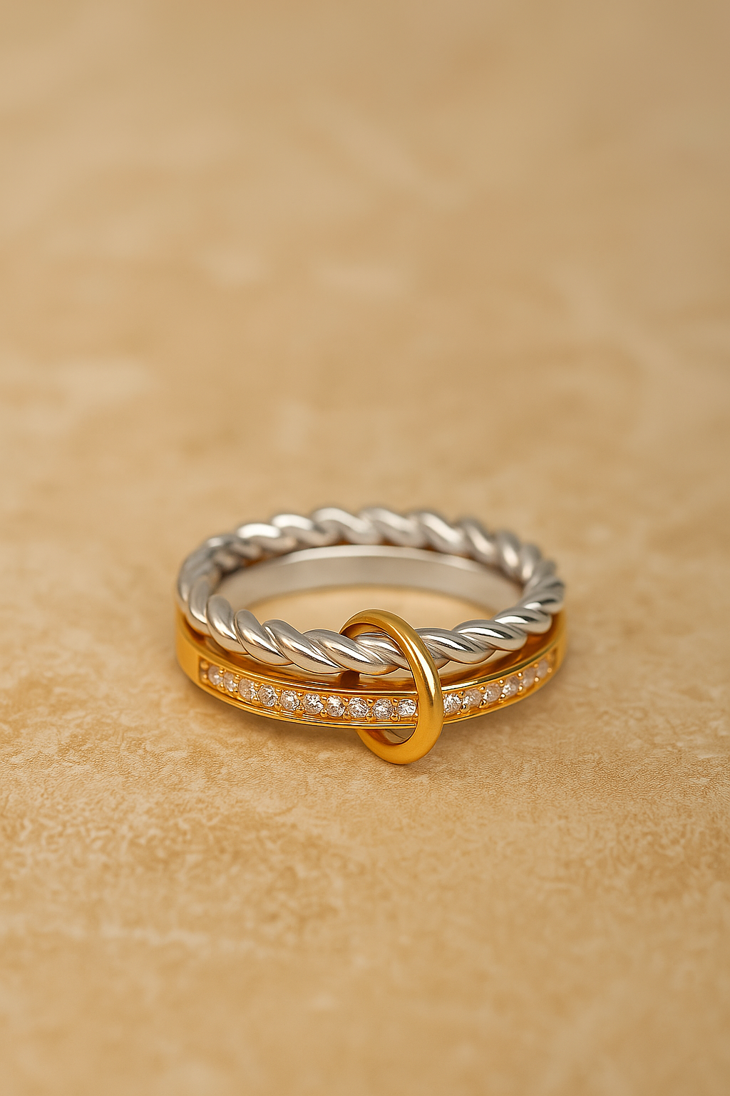 Two-tone ring components: gold pavé bar and silver twisted rope band linked together.