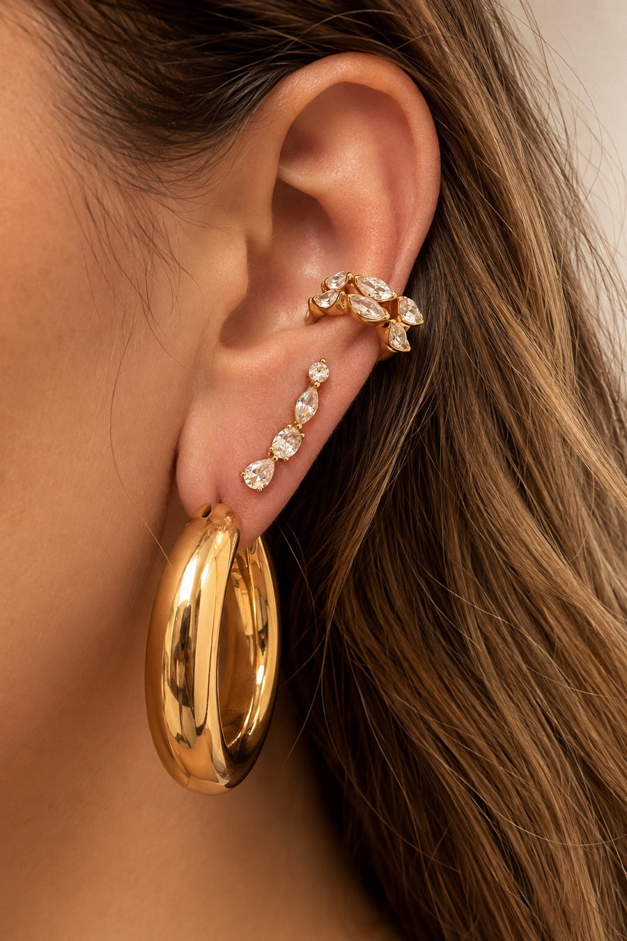 Gold ear stack by Galleria Armadoro featuring the 3 cm Gaga Hoop with delicate crystal ear jewellery.