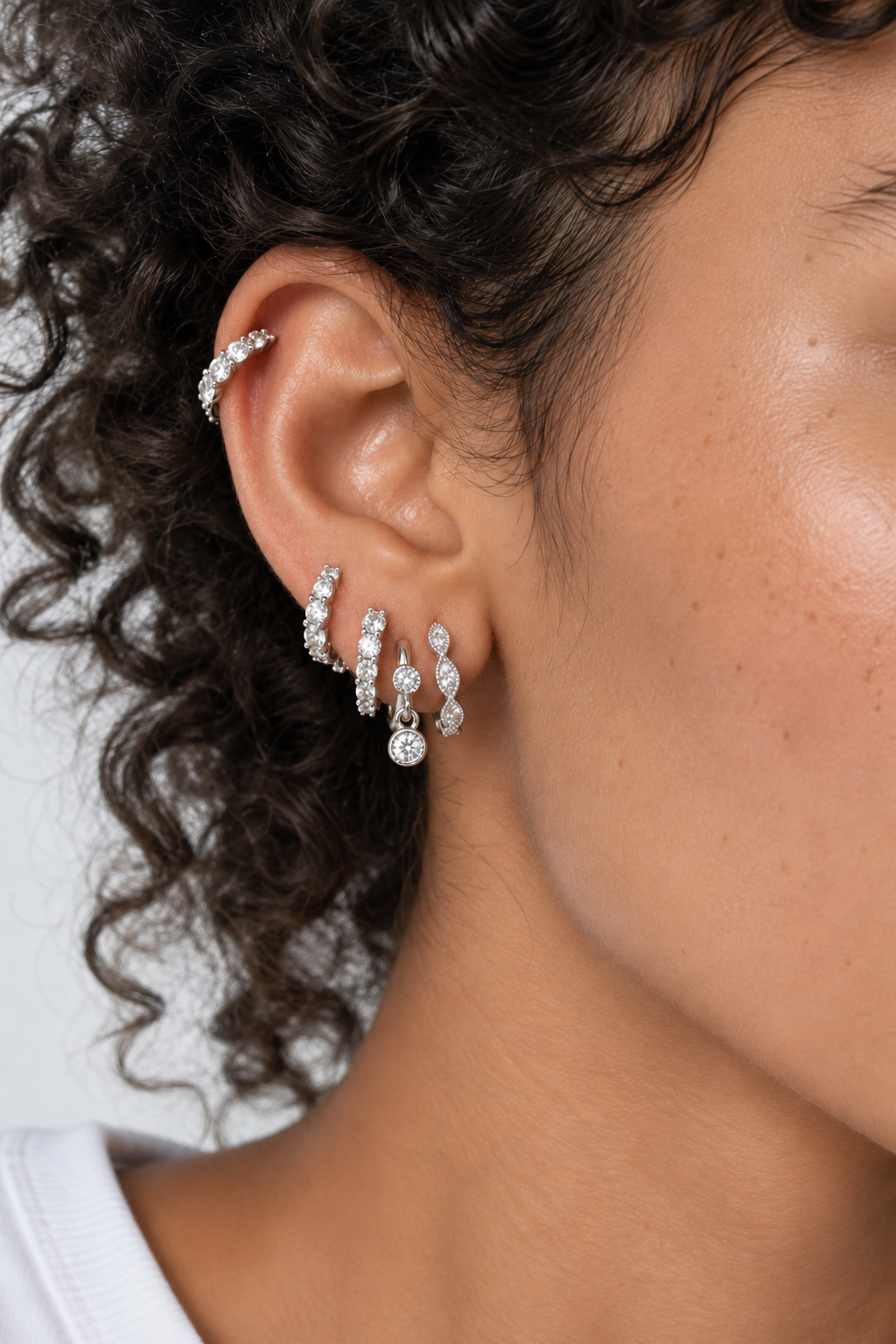 Silver ear stack by Galleria Armadoro featuring Gala, Gala Reverse, Tasha in the first lobe and Simple Shaker in the second lobe.