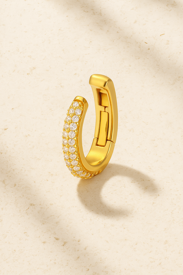 Gold Mina Pavé hinged ear cuff standing open, showing hinge mechanism and cubic zirconia stones.
