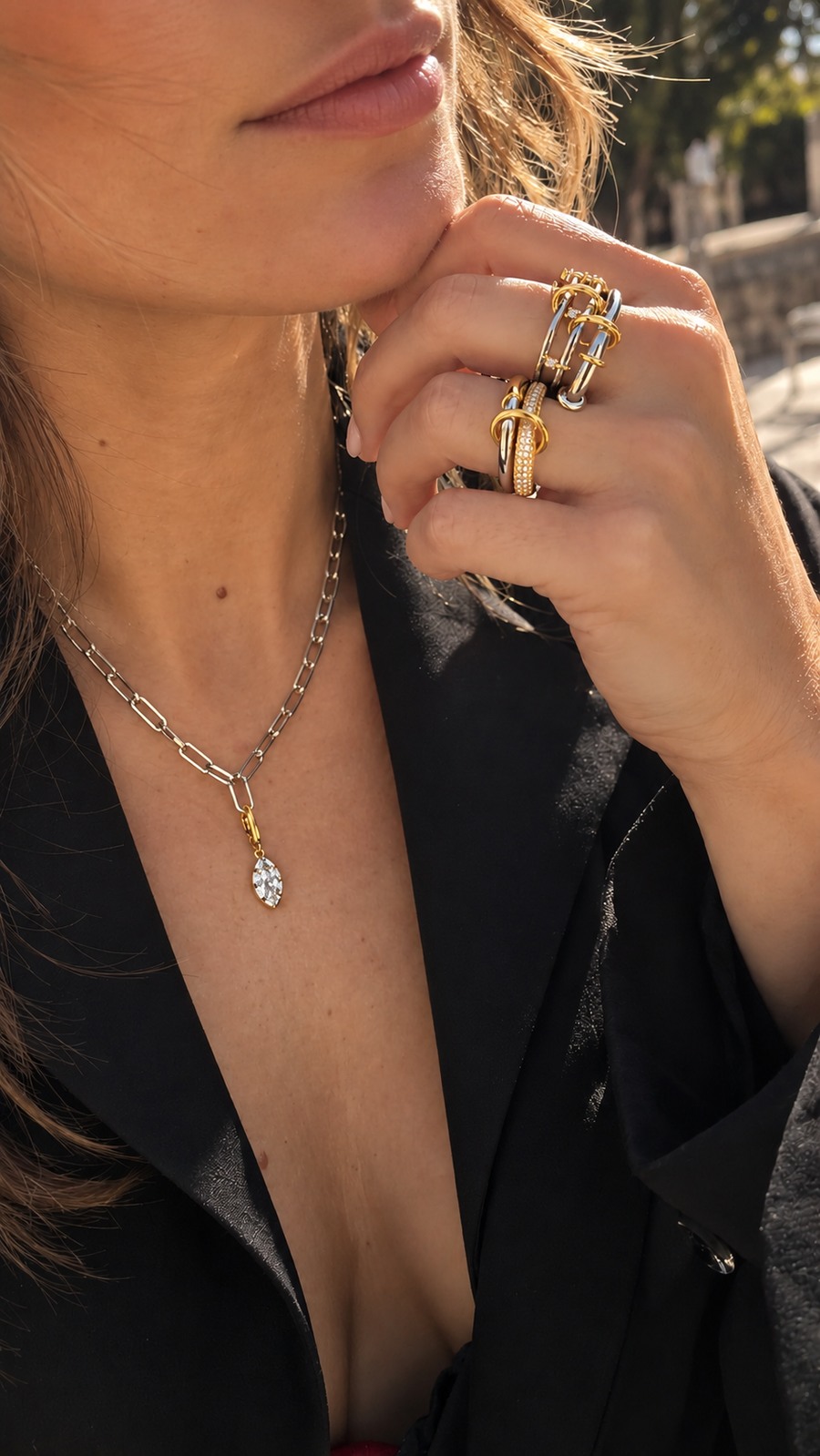 Mixed-metal jewellery look by Galleria Armadoro featuring a silver paperclip necklace with gold Vittoria marquise charm and sculptural gold, silver and pavé linked rings.