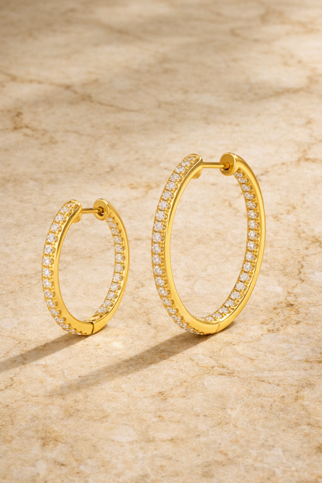 Double ear piercing gold vermeil inside out pavé hoop set with 18mm and 22mm white CZ stones