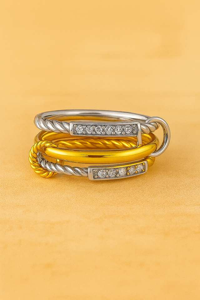 Two-tone iteration of the Carmella Speira rings laid flat, showing silver rope and gold polished bands.