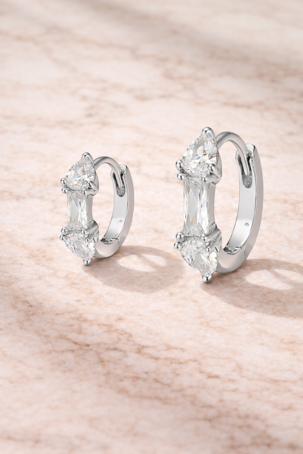 Double ear piercing sterling silver mini hoop set with 6.5mm and 8.5mm Ivy huggies and white cubic zirconia