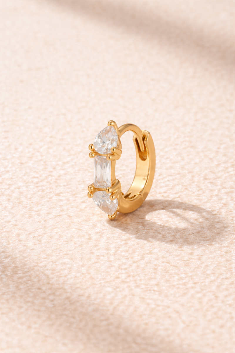 “Ivy Mini Hoop gold 6.5 mm huggie with white cubic zirconia stones”