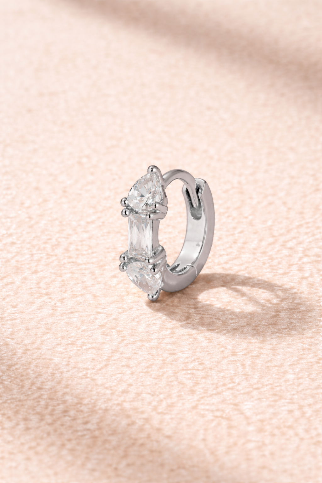 “Ivy Mini Hoop silver 6.5 mm huggie with white cubic zirconia stones”