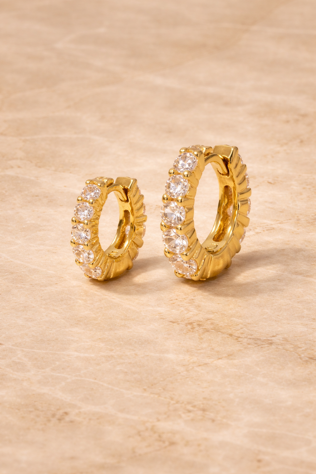 Double ear piercing gold vermeil huggie set with 6.5mm and 8.5mm graduated white CZ stones