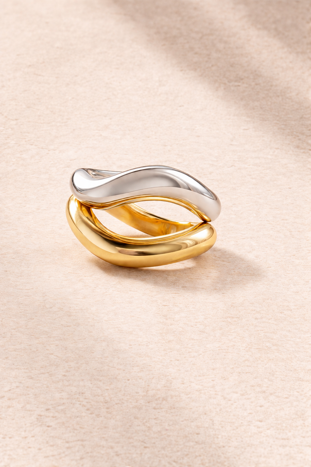 Kyma Vector ring duo with gold vermeil and sterling silver wave rings stacked together