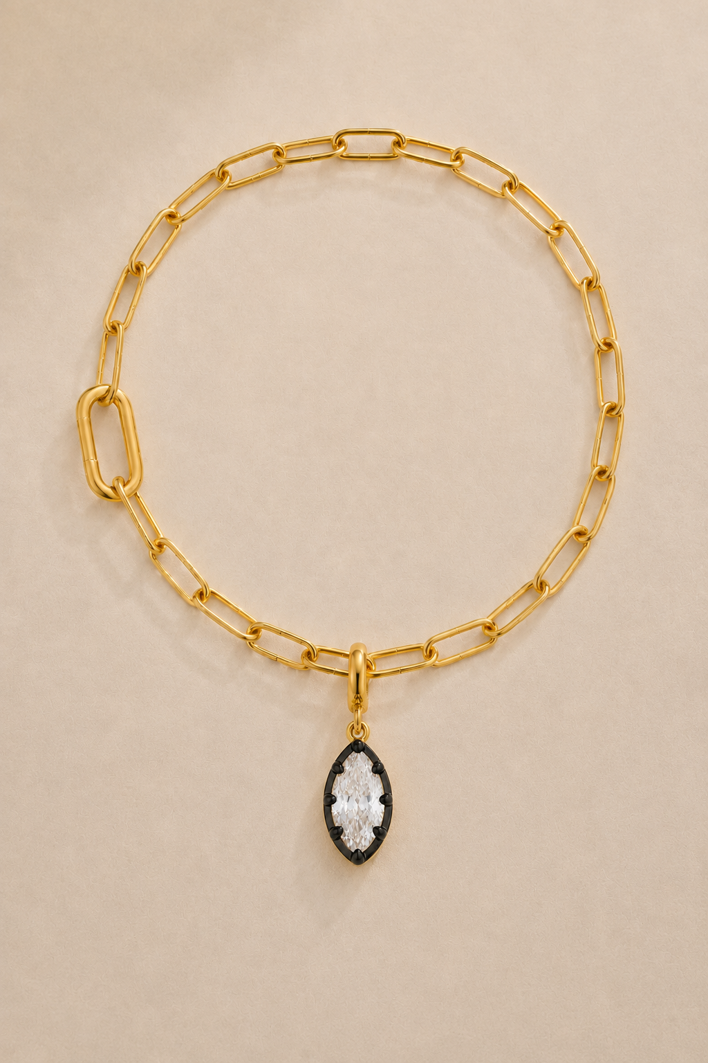 Gold paperclip bracelet with Vittoria black and gold marquise crystal charm