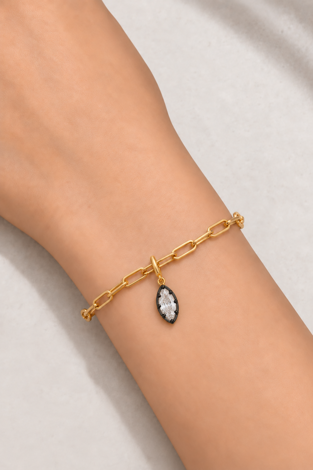 Gold paperclip bracelet with Vittoria black and gold marquise crystal charm