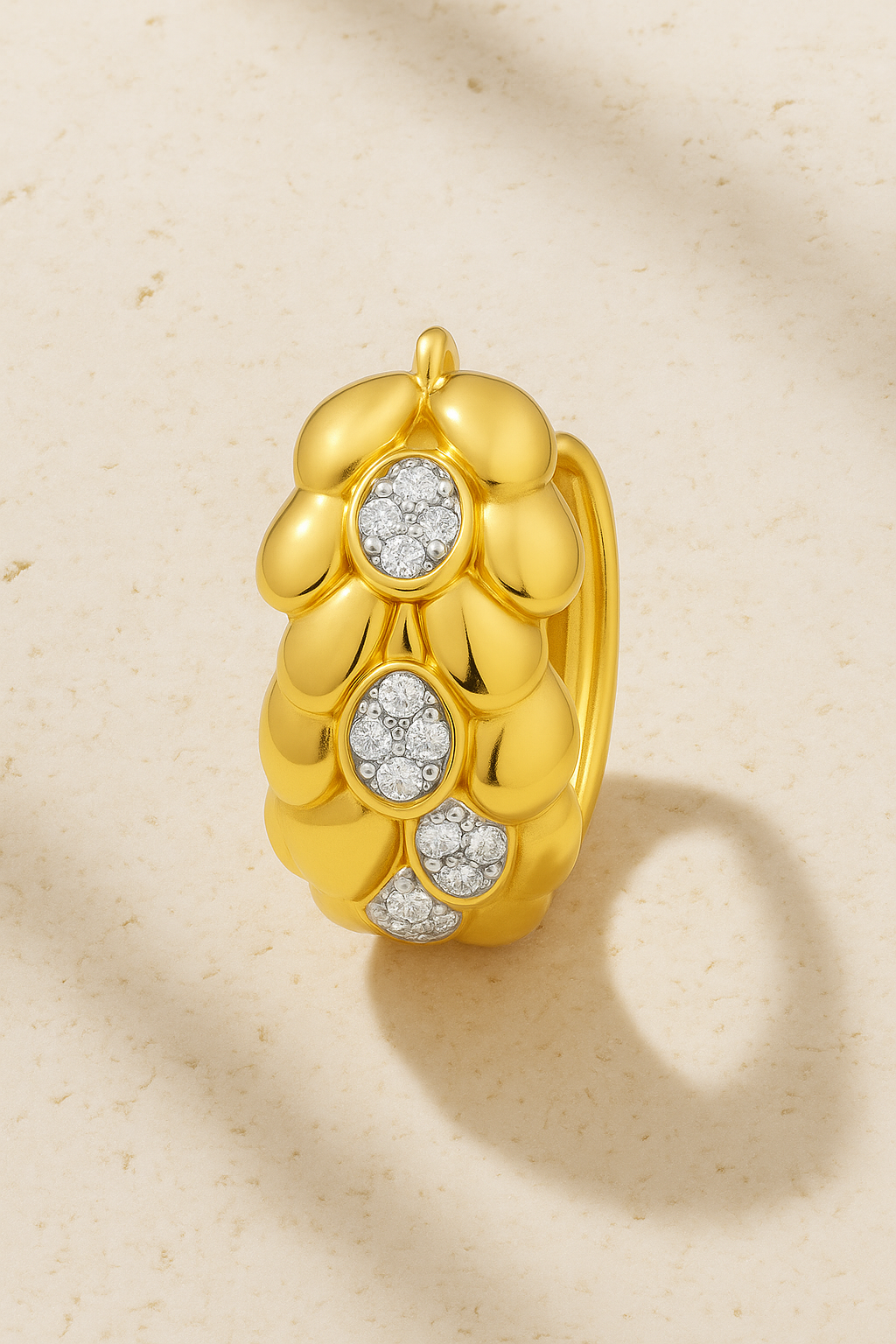 Leona Gold Huggie Earring in sculptural 18ct gold-plated sterling silver with hand-set pavé CZ stones, designed by Galleria Armadoro.
