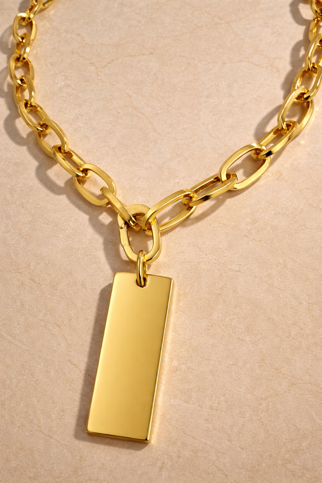Medium gold vermeil dog tag pendant on Cara chunky gold plated chain necklace, close-up