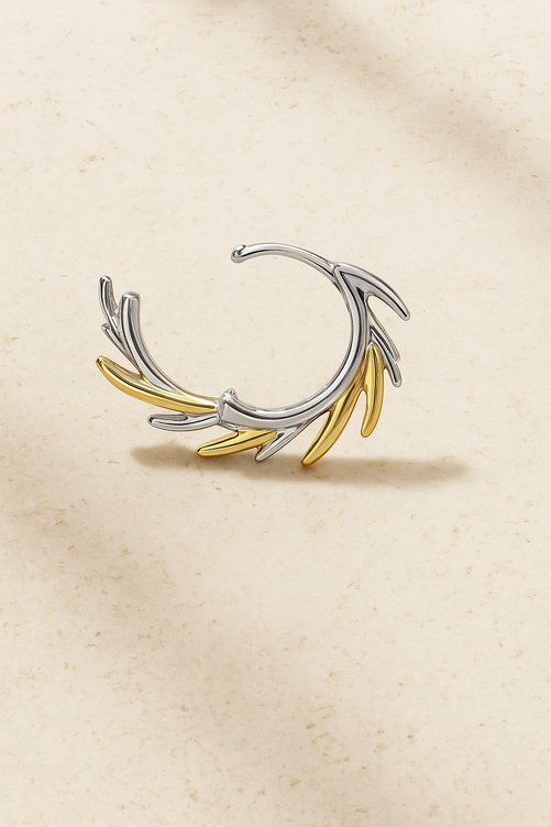 Open view of Elara Two-Tone Huggie Earring showing fluid sculptural form in gold and silver plating with CZ pavé details.
