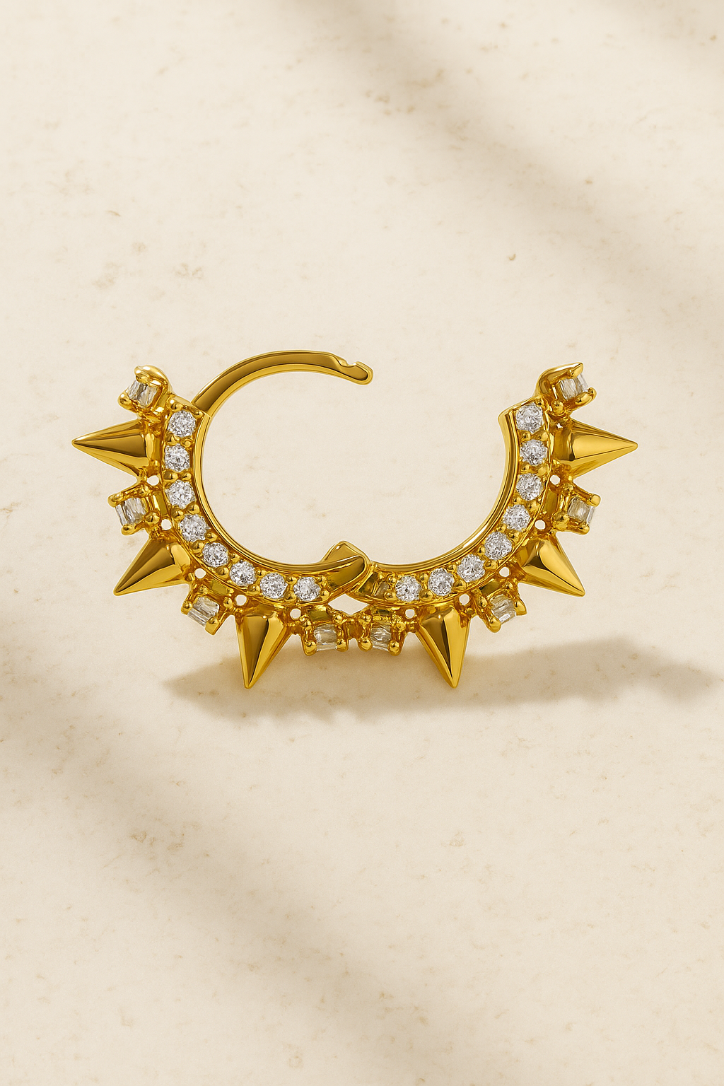 Open view of Spina Gold Huggie Earring showing spike details and hand-set pavé cubic zirconia in polished 18ct gold plating.
