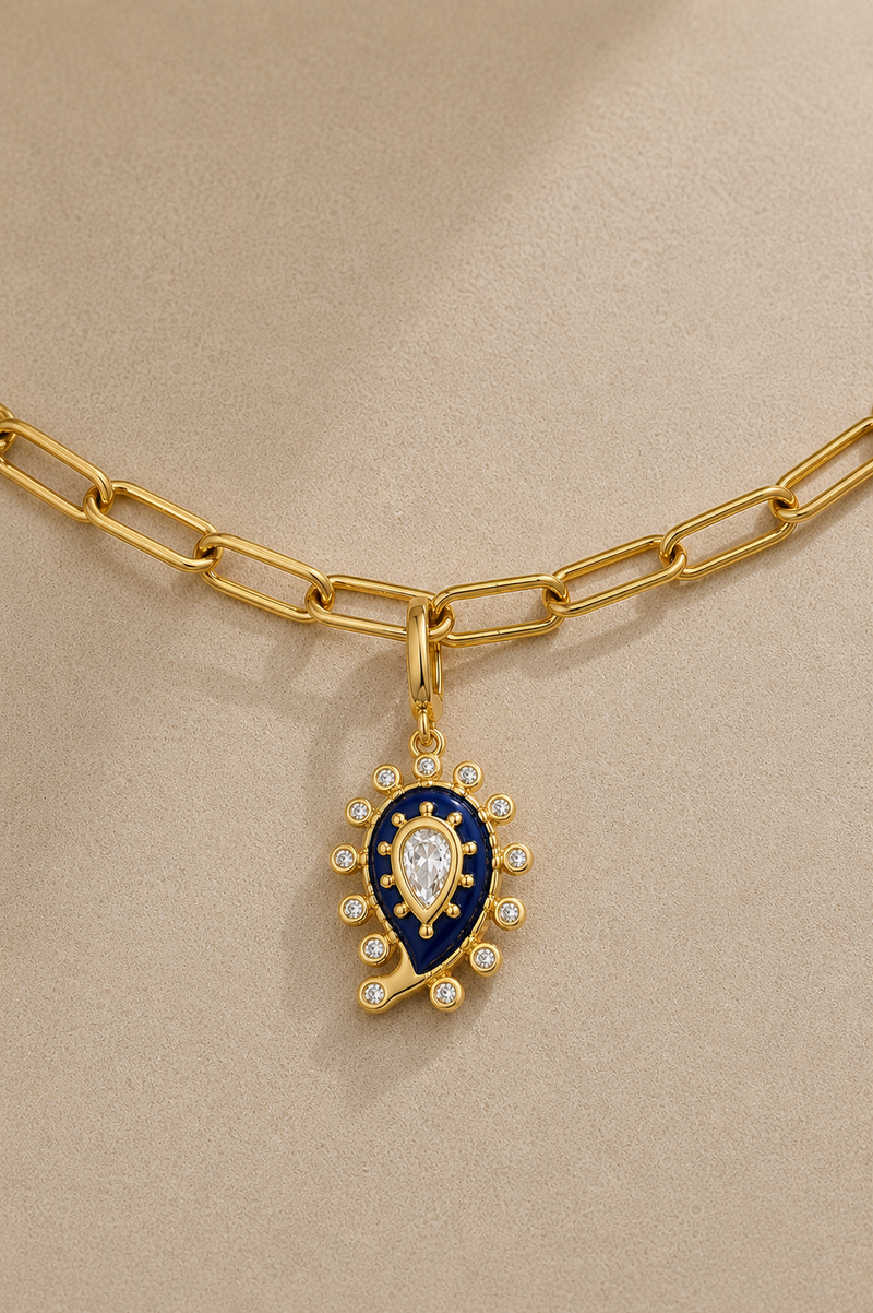 Gold paperclip anklet with blue paisley evil eye charm and crystal details