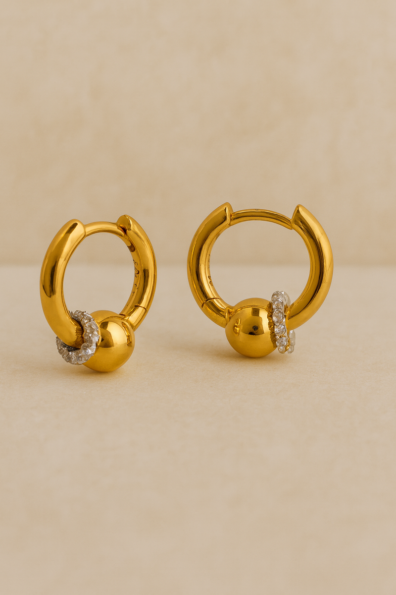 Pair of Kora gold bead huggie earrings with halo-set crystals