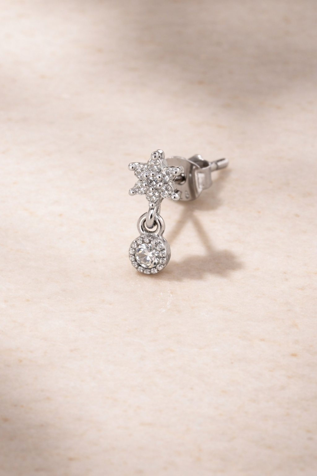 Side view of Romy Silver stud earring showing butterfly fastening and drop detail