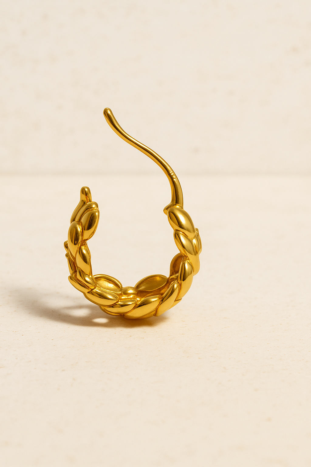 Side angle of Leona Gold Huggie Earring — 13mm sculptural hoop with petal texture and CZ pavé details by Galleria Armadoro.
