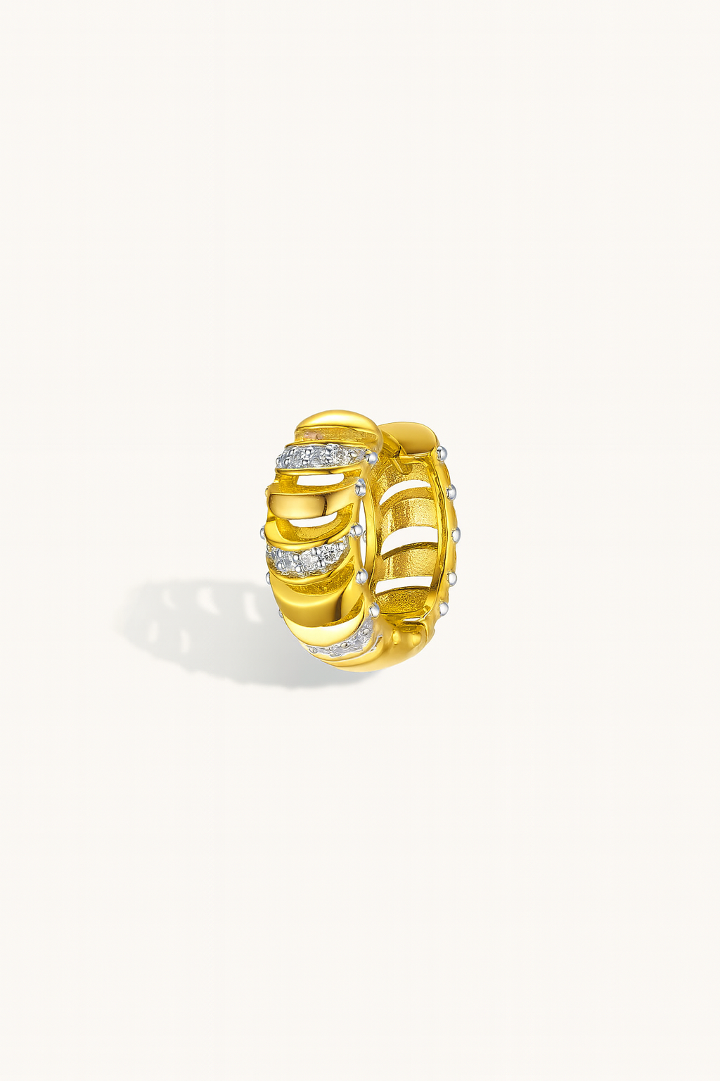 Side view of Noor Gold Huggie Earring showing 18ct gold plating and pavé CZ stones — hypoallergenic sterling silver huggie earring.

