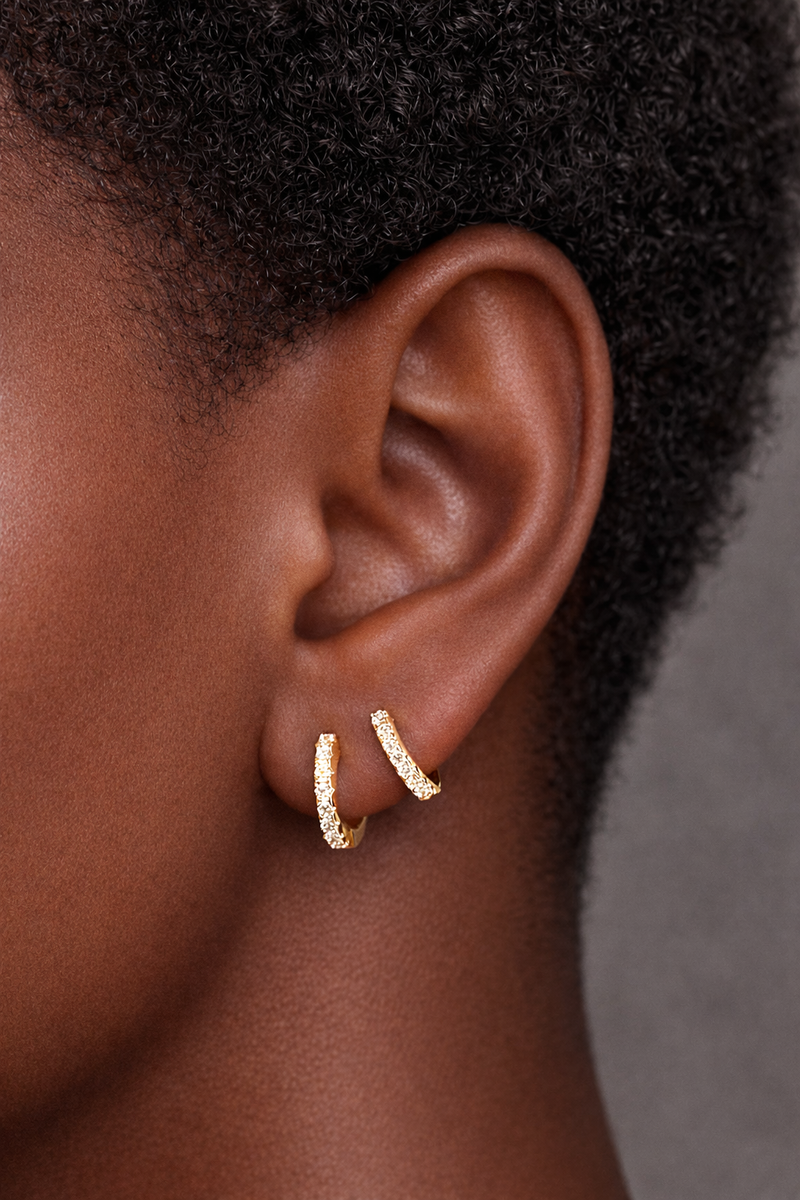 Two earrings in one ear styling with simple gold vermeil pavé huggies for second ear piercings and helix